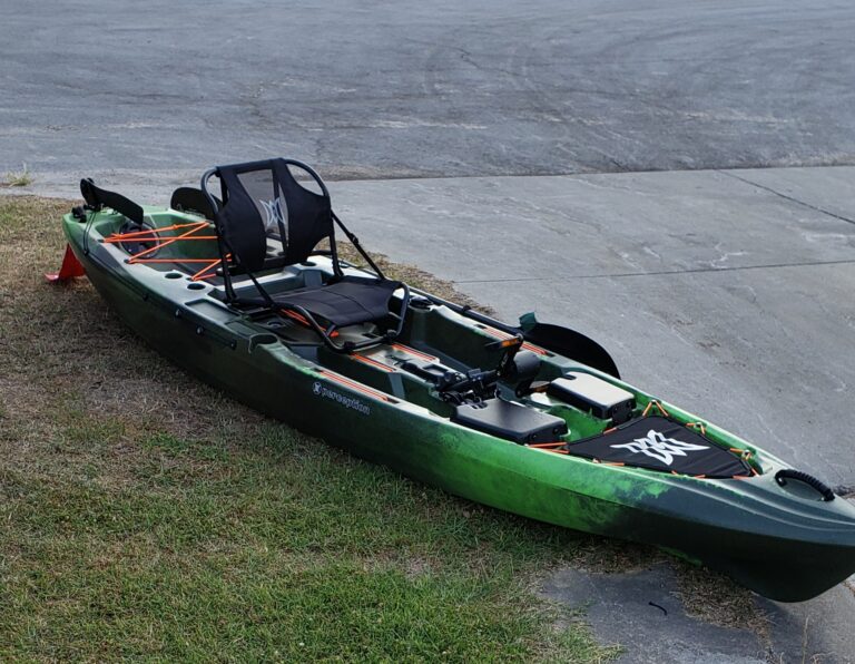 Green Perception Pilot kayak with orange accents